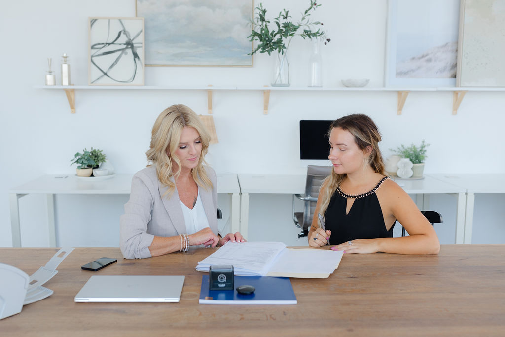 Documents being reviewed during a mobile notary signing